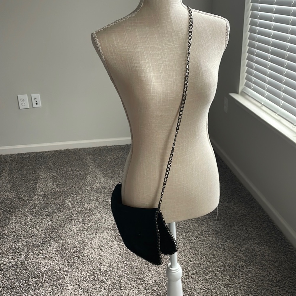 Black cross body chic fold over bag.